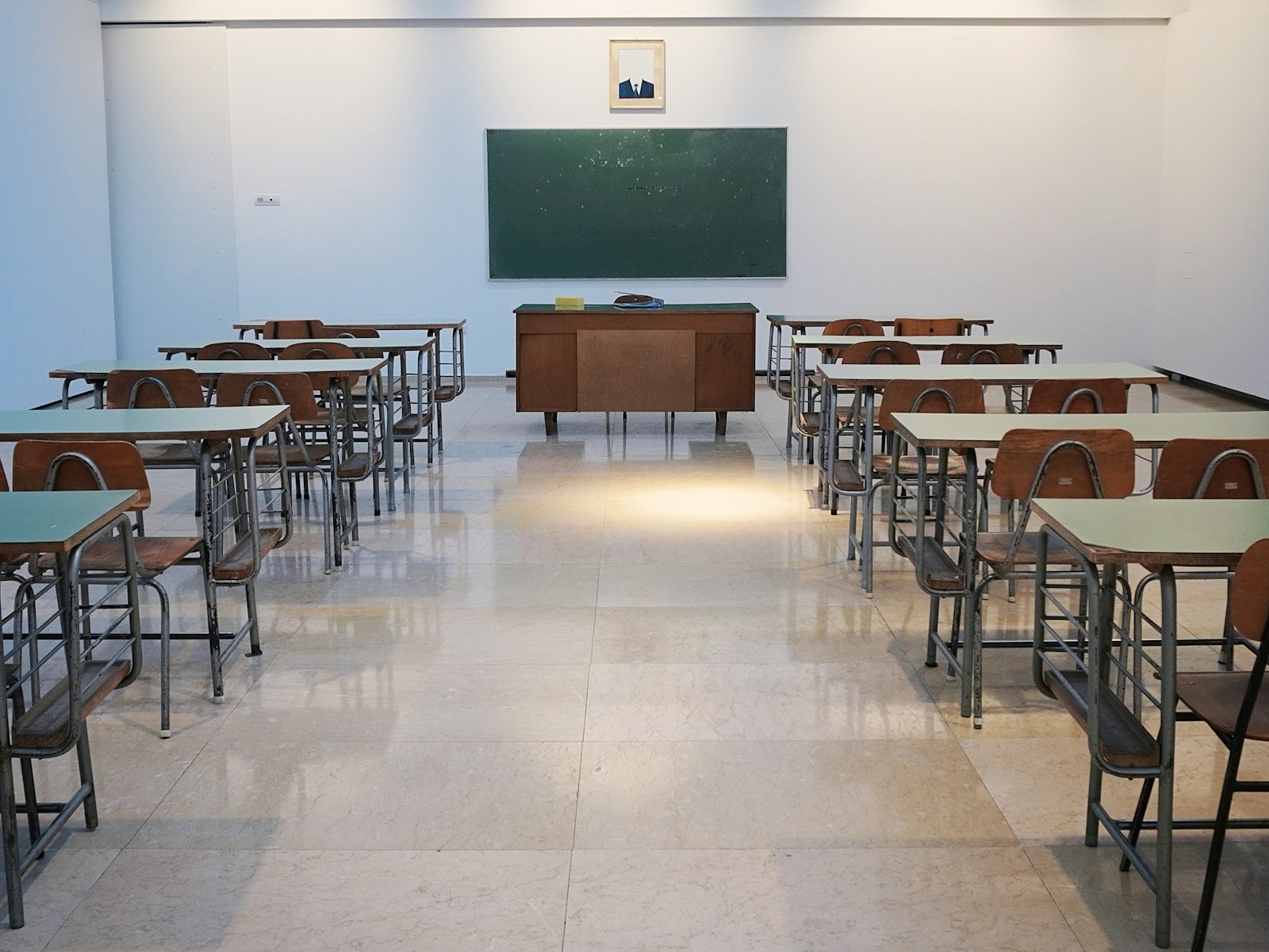 Empty K-12 classroom with chalkboard